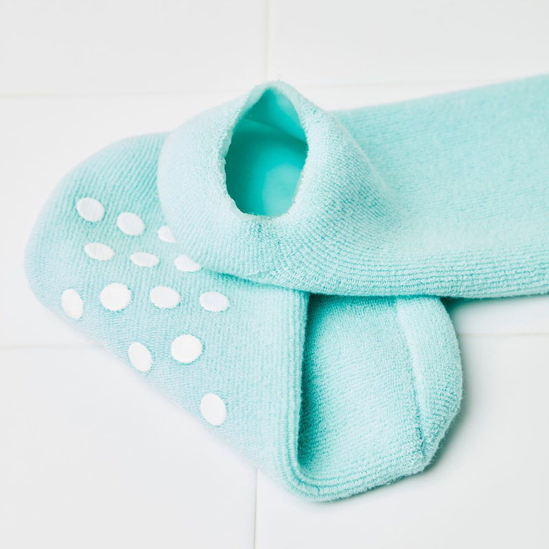 Sleep On It + Cotton socks with closeup of anti-slip dots on the bottom